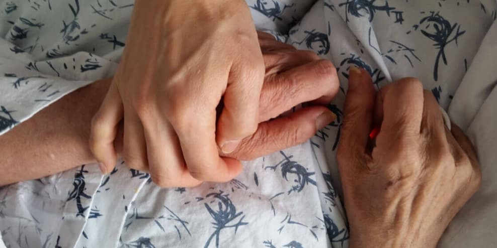 Hands held together in support